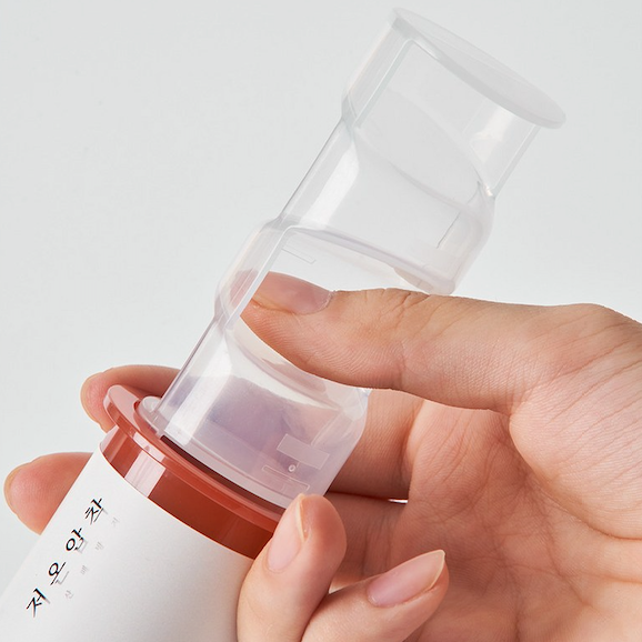 Person holding Syringe of Perilla Seed Oil Dispenser