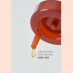 Drop of perilla oil coming out of bottle syringe