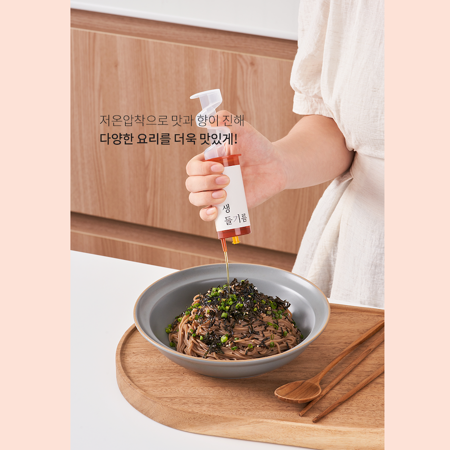 Woman adds Perilla Oil to cold noodles